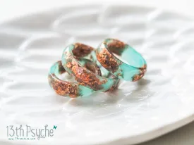 Aqua faceted resin ring with rose gold flakes