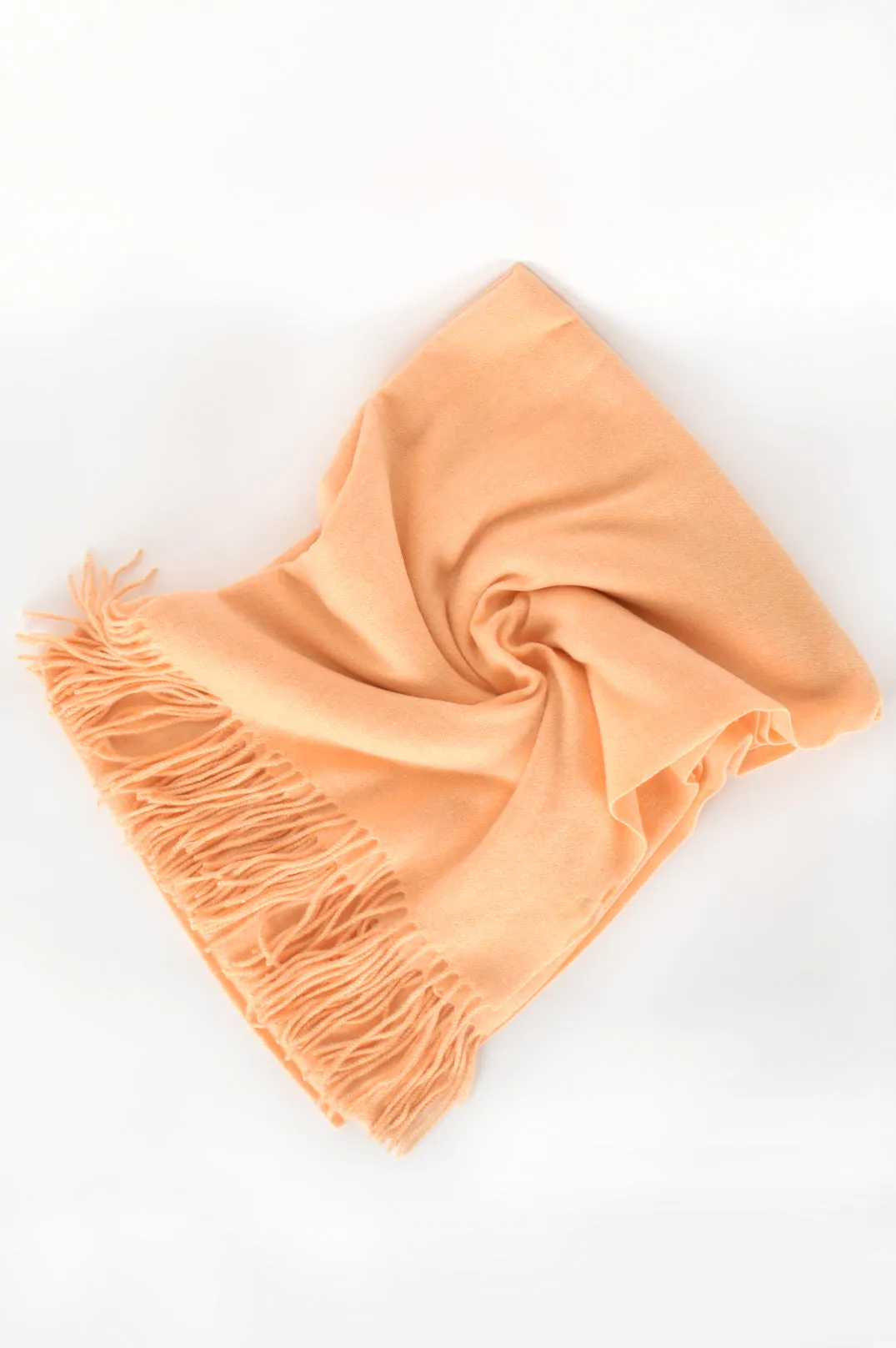 Get Cozy Fringe Scarf available in Mango and Peach Colours